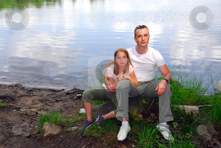 To use this stock image in your creative project, please select the size you need over to the right and click the "Add to Cart" button.
Your downloaded image will come with the Cutcaster watermark removed so don’t worry about the watermark you see on this page. Portrait father daughter stock photo, Portrait of father and daughter on the lake shore by Elena Elisseeva