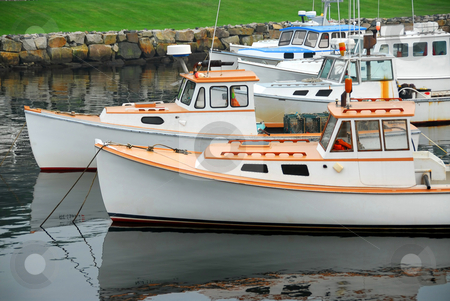 To use this stock image in your creative project, please select the size you need over to the right and click the "Add to Cart" button.
Your downloaded image will come with the Cutcaster watermark removed so don’t worry about the watermark you see on this page. Fishing boats in harbor stock photo, Fishing boats in a harbor in Perkins Cove, Maine by Elena Elisseeva