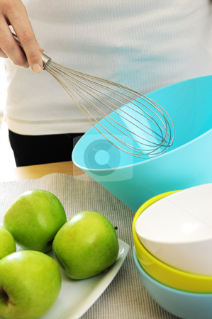 To use this stock image in your creative project, please select the size you need over to the right and click the "Add to Cart" button.
Your downloaded image will come with the Cutcaster watermark removed so don’t worry about the watermark you see on this page. Cooking stock photo, Woman preparing food with whisk and bowl by Elena Elisseeva