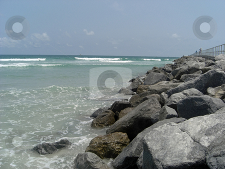 To use this stock image in your creative project, please select the size you need over to the right and click the "Add to Cart" button.
Your downloaded image will come with the Cutcaster watermark removed so don’t worry about the watermark you see on this page. The ocean bolders stock photo, Huge rocks and bolders are lined at the edge of the ocean in Ponce Inlet, FL. by Rebecca Mosoetsa