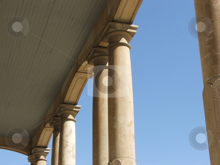 To use this stock image in your creative project, please select the size you need over to the right and click the "Add to Cart" button.
Your downloaded image will come with the Cutcaster watermark removed so don’t worry about the watermark you see on this page. Roman columns in Iowa stock photo, The Madison County Courthouse, located in the center of the townsquare in Winterset, Iowa displays limestone column porticos on all four sides of the 1876 structure. Winterset and the covered bridges of Madison County are the setting for