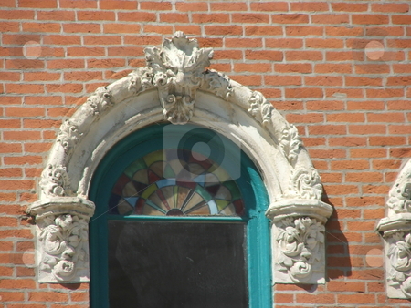 To use this stock image in your creative project, please select the size you need over to the right and click the "Add to Cart" button.
Your downloaded image will come with the Cutcaster watermark removed so don’t worry about the watermark you see on this page. Unique decorated old window stock photo, Unique Italian architectural details and decorations grace this old double hung window on a storefront in Winterset, Iowa. by Dennis Thomsen