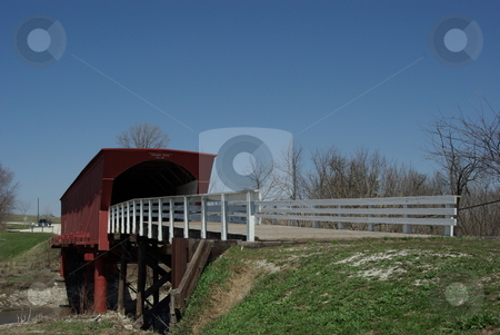 To use this stock image in your creative project, please select the size you need over to the right and click the "Add to Cart" button.
Your downloaded image will come with the Cutcaster watermark removed so don’t worry about the watermark you see on this page. Old Roseman Covered Bridge stock photo, The Roseman Bridge (built in 1883) is a popular tourist attraction for visitors to the sleepy town of Winterset, Iowa. The covered bridges in south central Iowa, not far from Des Moines, gained fame from the popularity of the movie and book,