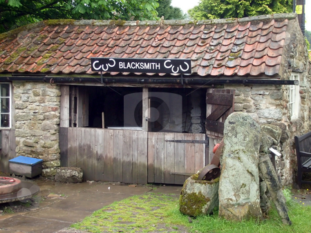 To use this stock image in your creative project, please select the size you need over to the right and click the "Add to Cart" button.
Your downloaded image will come with the Cutcaster watermark removed so don’t worry about the watermark you see on this page. Blacksmiths Shop stock photo, Old fashioned English Blacksmiths shop in countryside, Yorkshire, England. by Martin Crowdy