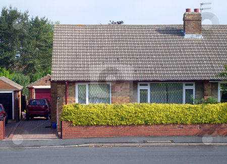To use this stock image in your creative project, please select the size you need over to the right and click the "Add to Cart" button.
Your downloaded image will come with the Cutcaster watermark removed so don’t worry about the watermark you see on this page. Typical English Bungalow stock photo, Typical English Bungalow on housing estate in Scarborough, England. by Martin Crowdy
