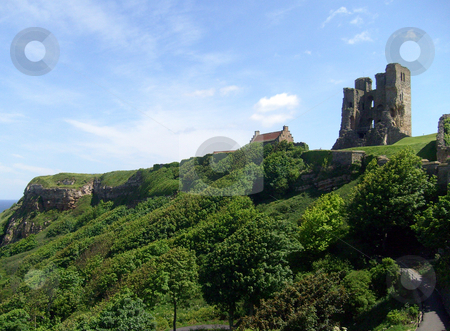 To use this stock image in your creative project, please select the size you need over to the right and click the "Add to Cart" button.
Your downloaded image will come with the Cutcaster watermark removed so don’t worry about the watermark you see on this page. Scarborough Castle view stock photo, View of Scarborough's Norman Castle remains on castle headland, Scarborough, North Yorkshire, England. by Martin Crowdy