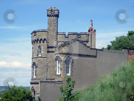 To use this stock image in your creative project, please select the size you need over to the right and click the "Add to Cart" button.
Your downloaded image will come with the Cutcaster watermark removed so don’t worry about the watermark you see on this page. Historic castle shaped house stock photo, Historic house sahped like a castle with battlements and turrets. by Martin Crowdy
