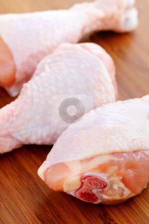 To use this stock image in your creative project, please select the size you need over to the right and click the "Add to Cart" button.
Your downloaded image will come with the Cutcaster watermark removed so don’t worry about the watermark you see on this page. Raw chicken drumsticks stock photo, Raw chicken drumsticks on a wooden cutting board by Elena Elisseeva