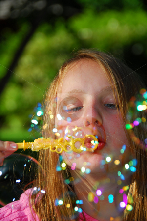 To use this stock image in your creative project, please select the size you need over to the right and click the "Add to Cart" button.
Your downloaded image will come with the Cutcaster watermark removed so don’t worry about the watermark you see on this page. Young girl soap bubbles stock photo, Young girl blowing soap bubbles by Elena Elisseeva