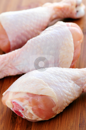 To use this stock image in your creative project, please select the size you need over to the right and click the "Add to Cart" button.
Your downloaded image will come with the Cutcaster watermark removed so don’t worry about the watermark you see on this page. Raw chicken drumsticks stock photo, Raw chicken drumsticks on a wooden cutting board by Elena Elisseeva