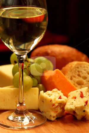 To use this stock image in your creative project, please select the size you need over to the right and click the "Add to Cart" button.
Your downloaded image will come with the Cutcaster watermark removed so don’t worry about the watermark you see on this page. Wine tasting stock photo, Glass of white wine and assorted cheeses for wine tasting by Elena Elisseeva