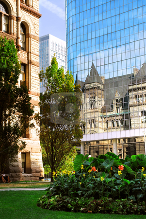 To use this stock image in your creative project, please select the size you need over to the right and click the "Add to Cart" button.
Your downloaded image will come with the Cutcaster watermark removed so don’t worry about the watermark you see on this page. Toronto stock photo, Reflection of old Toronto city hall building in a glass wall of a modern highrise building by Elena Elisseeva