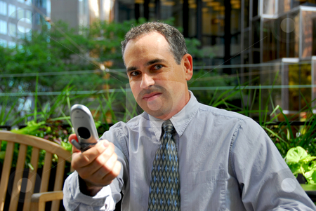 To use this stock image in your creative project, please select the size you need over to the right and click the "Add to Cart" button.
Your downloaded image will come with the Cutcaster watermark removed so don’t worry about the watermark you see on this page. Businessman phone stock photo, Portrait of a busy businessman in the city holding a cell phone by Elena Elisseeva