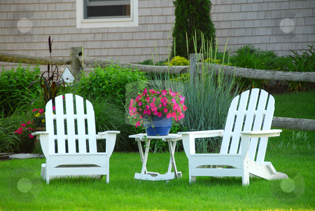 To use this stock image in your creative project, please select the size you need over to the right and click the "Add to Cart" button.
Your downloaded image will come with the Cutcaster watermark removed so don’t worry about the watermark you see on this page. Two lawn chairs stock photo, Two lawn chairs in a beautifl garden near cottage by Elena Elisseeva