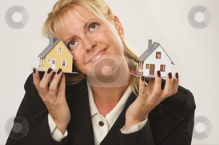 To use this stock image in your creative project, please select the size you need over to the right and click the "Add to Cart" button.
Your downloaded image will come with the Cutcaster watermark removed so don’t worry about the watermark you see on this page. Houses in Female Hands stock photo, Female dreaming while holding two houses. by Andy Dean