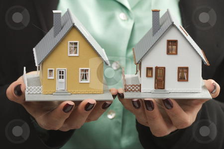To use this stock image in your creative project, please select the size you need over to the right and click the "Add to Cart" button.
Your downloaded image will come with the Cutcaster watermark removed so don’t worry about the watermark you see on this page. Houses in Female Hands stock photo, Female hands holding two houses. by Andy Dean