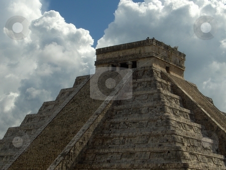 To use this stock image in your creative project, please select the size you need over to the right and click the "Add to Cart" button.
Your downloaded image will come with the Cutcaster watermark removed so don’t worry about the watermark you see on this page. Chichen Itza stock photo, A pyramid at the Chichen Itza complex of ruins in Mexico, against a dramatic sky. by Jessica Tooley
