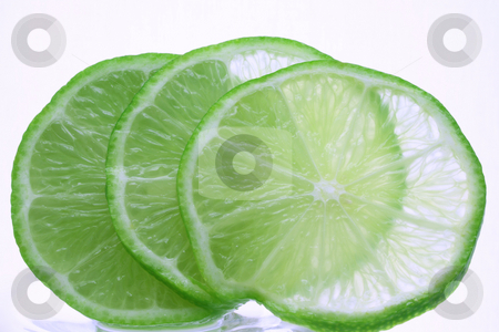 To use this stock image in your creative project, please select the size you need over to the right and click the "Add to Cart" button.
Your downloaded image will come with the Cutcaster watermark removed so don’t worry about the watermark you see on this page. Lime stock photo, A lime, sliced and fanned out isolated on white by Jessica Tooley