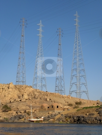 To use this stock image in your creative project, please select the size you need over to the right and click the "Add to Cart" button.
Your downloaded image will come with the Cutcaster watermark removed so don’t worry about the watermark you see on this page. Progress stock photo, Electricity transmission lines loom over traditional homes on the Nile in Egypt. by Jessica Tooley