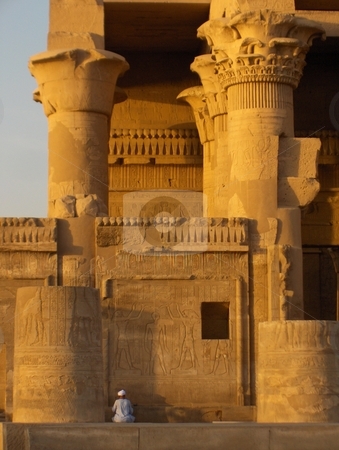 To use this stock image in your creative project, please select the size you need over to the right and click the "Add to Cart" button.
Your downloaded image will come with the Cutcaster watermark removed so don’t worry about the watermark you see on this page. Kom Ombo Temple stock photo, An Egyptian man examining a wall at the Kom Ombo Temple in Egypt by Jessica Tooley