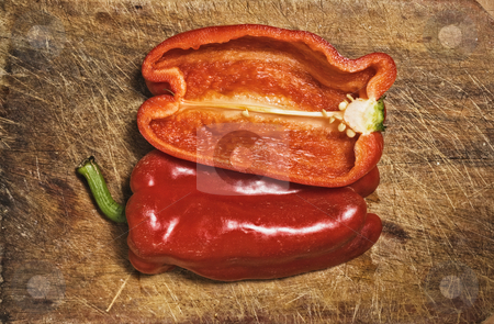 To use this stock image in your creative project, please select the size you need over to the right and click the "Add to Cart" button.
Your downloaded image will come with the Cutcaster watermark removed so don’t worry about the watermark you see on this page. Red pepper stock photo, Red pepper on old cutting table. by Pablo Caridad