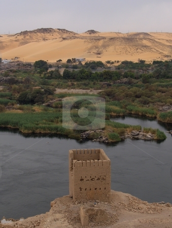 To use this stock image in your creative project, please select the size you need over to the right and click the "Add to Cart" button.
Your downloaded image will come with the Cutcaster watermark removed so don’t worry about the watermark you see on this page. Tower on the Nile stock photo, A crumbling tower overlooking the Nile in Egypt. by Jessica Tooley