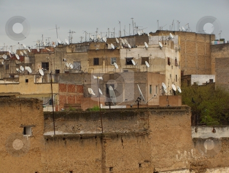 To use this stock image in your creative project, please select the size you need over to the right and click the "Add to Cart" button.
Your downloaded image will come with the Cutcaster watermark removed so don’t worry about the watermark you see on this page. Progress stock photo, Satellite television dishes on the roofs of ancient buildings in Morocco by Jessica Tooley