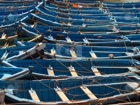 To use this stock image in your creative project, please select the size you need over to the right and click the "Add to Cart" button.
Your downloaded image will come with the Cutcaster watermark removed so don’t worry about the watermark you see on this page. Fishing Boats stock photo, Blue painted fishing boats in harbour. by Jessica Tooley