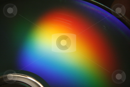 To use this stock image in your creative project, please select the size you need over to the right and click the "Add to Cart" button.
Your downloaded image will come with the Cutcaster watermark removed so don’t worry about the watermark you see on this page. Spectrum stock photo, Rainbow of light reflected on the surface of a compact disc. by Nathan Smith
