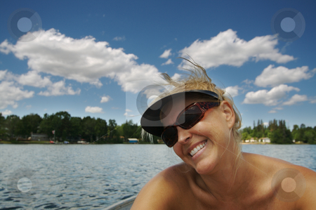 To use this stock image in your creative project, please select the size you need over to the right and click the "Add to Cart" button.
Your downloaded image will come with the Cutcaster watermark removed so don’t worry about the watermark you see on this page. Day on the Lake stock photo, Beautiful woman enjoys a summer day on the lake. by Andy Dean