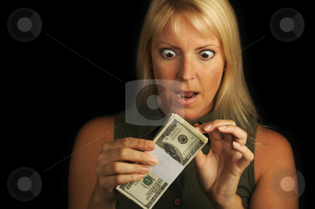 To use this stock image in your creative project, please select the size you need over to the right and click the "Add to Cart" button.
Your downloaded image will come with the Cutcaster watermark removed so don’t worry about the watermark you see on this page. Money In Hand stock photo, Attractive Woman Excited About her Stack of Money She Holds by Andy Dean