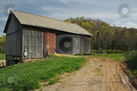 To use this stock image in your creative project, please select the size you need over to the right and click the "Add to Cart" button.
Your downloaded image will come with the Cutcaster watermark removed so don’t worry about the watermark you see on this page. Abandoned Barn stock photo, Abandoned barn and country scene. by Andy Dean