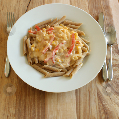 To use this stock image in your creative project, please select the size you need over to the right and click the "Add to Cart" button.
Your downloaded image will come with the Cutcaster watermark removed so don’t worry about the watermark you see on this page. Pasta with White Vegetable Sauce stock photo, Whole wheat penne pasta, cooked and served with a vegetable white sauce, on a white plate upon a wooden table. by Jessica Tooley