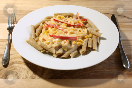 To use this stock image in your creative project, please select the size you need over to the right and click the "Add to Cart" button.
Your downloaded image will come with the Cutcaster watermark removed so don’t worry about the watermark you see on this page. Cooked Pasta stock photo, Whole wheat penne pasta, cooked and served with a vegetable white sauce, on a white plate upon a wooden table. by Jessica Tooley