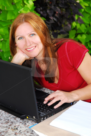 To use this stock image in your creative project, please select the size you need over to the right and click the "Add to Cart" button.
Your downloaded image will come with the Cutcaster watermark removed so don’t worry about the watermark you see on this page. Working at home stock photo, Happy mature woman working on portable computer at home, small business owner by Elena Elisseeva