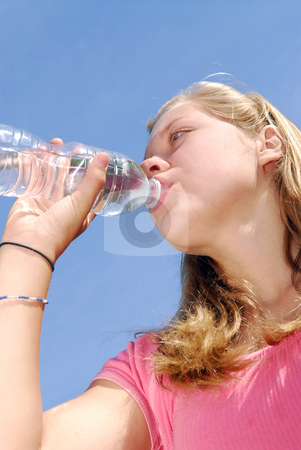 To use this stock image in your creative project, please select the size you need over to the right and click the "Add to Cart" button.
Your downloaded image will come with the Cutcaster watermark removed so don’t worry about the watermark you see on this page. Young girl drinking water stock photo, Young girl drinking water from clear plastic bottle by Elena Elisseeva
