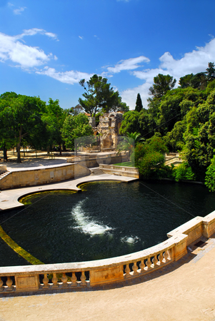 To use this stock image in your creative project, please select the size you need over to the right and click the "Add to Cart" button.
Your downloaded image will come with the Cutcaster watermark removed so don’t worry about the watermark you see on this page. Jardin de la Fontaine in Nimes France stock photo, Park Jardin de la Fontaine in city of Nimes in southern France by Elena Elisseeva