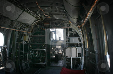 To use this stock image in your creative project, please select the size you need over to the right and click the "Add to Cart" button.
Your downloaded image will come with the Cutcaster watermark removed so don’t worry about the watermark you see on this page. Old Helicopter stock photo, The inside of a transport helicopter with the few to the front. by Henrik Lehnerer