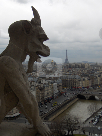 To use this stock image in your creative project, please select the size you need over to the right and click the "Add to Cart" button.
Your downloaded image will come with the Cutcaster watermark removed so don’t worry about the watermark you see on this page. Gargoyle stock photo, A gargoyle's view of Paris, including the Seine River and the Efiiel Tower, taken from atop the Notre Dame Cathedral. by Jessica Tooley