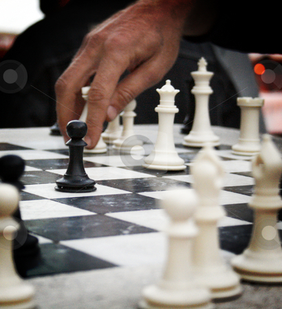 To use this stock image in your creative project, please select the size you need over to the right and click the "Add to Cart" button.
Your downloaded image will come with the Cutcaster watermark removed so don’t worry about the watermark you see on this page. Chess on the Square stock photo, A man's hand about to move a chess piece with a black pawn in the foreground. by Nathan Smith