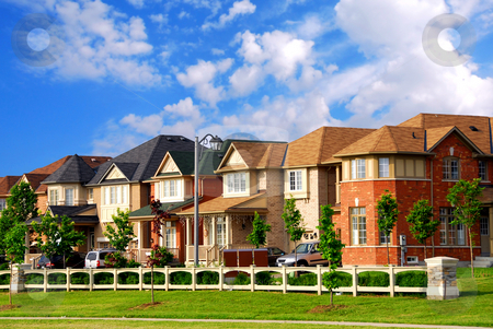 To use this stock image in your creative project, please select the size you need over to the right and click the "Add to Cart" button.
Your downloaded image will come with the Cutcaster watermark removed so don’t worry about the watermark you see on this page. Homes in a row stock photo, Row of new residential houses in suburban neighborhood by Elena Elisseeva