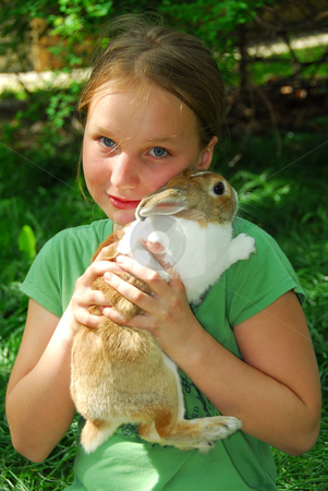 To use this stock image in your creative project, please select the size you need over to the right and click the "Add to Cart" button.
Your downloaded image will come with the Cutcaster watermark removed so don’t worry about the watermark you see on this page. Gril with bunny stock photo, Portrait of a young girl holding a bunny outside by Elena Elisseeva
