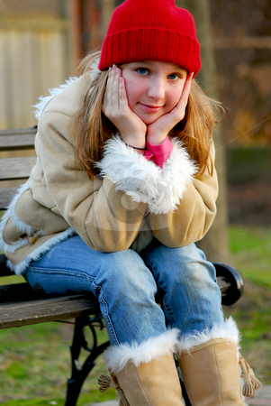 To use this stock image in your creative project, please select the size you need over to the right and click the "Add to Cart" button.
Your downloaded image will come with the Cutcaster watermark removed so don’t worry about the watermark you see on this page. Girl on bench stock photo, Portrait of a young girl sitting on a bench outside by Elena Elisseeva