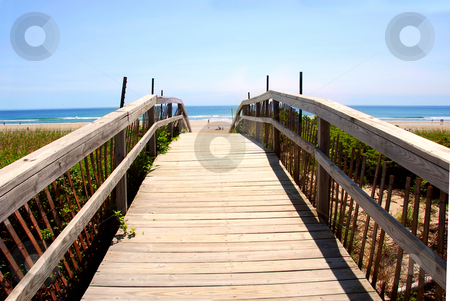 To use this stock image in your creative project, please select the size you need over to the right and click the "Add to Cart" button.
Your downloaded image will come with the Cutcaster watermark removed so don’t worry about the watermark you see on this page. Beach view stock photo, Wooden walkway over dunes with ocean view by Elena Elisseeva