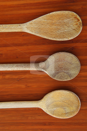 To use this stock image in your creative project, please select the size you need over to the right and click the "Add to Cart" button.
Your downloaded image will come with the Cutcaster watermark removed so don’t worry about the watermark you see on this page. Cooking spoons stock photo, Old wooden cooking spoons on a cutting board in a kitchen by Elena Elisseeva