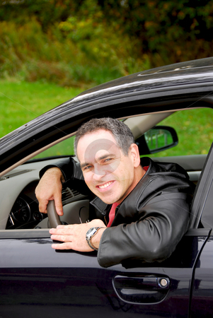 To use this stock image in your creative project, please select the size you need over to the right and click the "Add to Cart" button.
Your downloaded image will come with the Cutcaster watermark removed so don’t worry about the watermark you see on this page. Man in car stock photo, Smiling happy man looking from a car window by Elena Elisseeva
