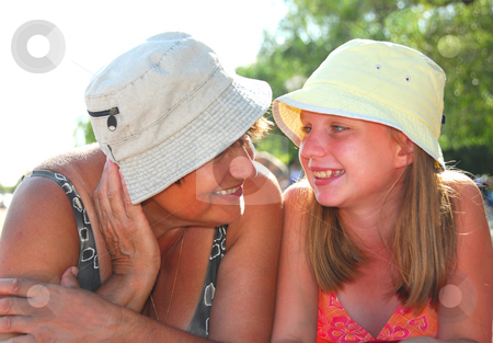 To use this stock image in your creative project, please select the size you need over to the right and click the "Add to Cart" button.
Your downloaded image will come with the Cutcaster watermark removed so don’t worry about the watermark you see on this page. Family beach stock photo, Portrait of grandmother and granddaughter lying on a sandy beach by Elena Elisseeva