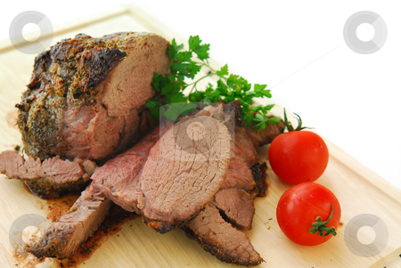 To use this stock image in your creative project, please select the size you need over to the right and click the "Add to Cart" button.
Your downloaded image will come with the Cutcaster watermark removed so don’t worry about the watermark you see on this page. Beef roast stock photo, Beef roast cut on a wooden cutting board by Elena Elisseeva