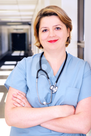To use this stock image in your creative project, please select the size you need over to the right and click the "Add to Cart" button.
Your downloaded image will come with the Cutcaster watermark removed so don’t worry about the watermark you see on this page. Nurse in a hospital stock photo, Portrait of a smiling nurse in standing in a hospital corridor by Elena Elisseeva