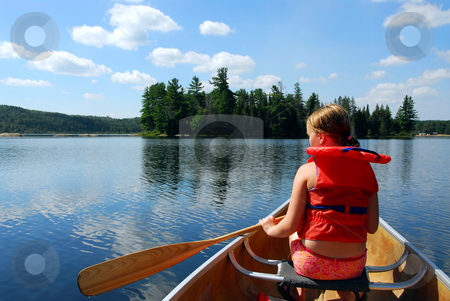 To use this stock image in your creative project, please select the size you need over to the right and click the "Add to Cart" button.
Your downloaded image will come with the Cutcaster watermark removed so don’t worry about the watermark you see on this page. Child in canoe stock photo, Young girl in canoe paddling on a scenic lake by Elena Elisseeva